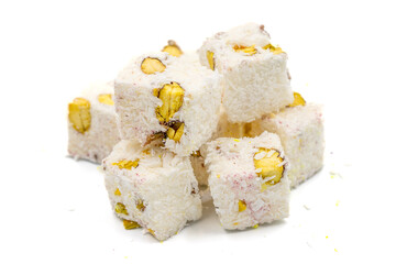 Turkish Delight Double Roasted Sultan Wick with Coconut Flakes, isolated on a white background. Close-up pistachio Turkish delight. Traditional Turkish cuisine delicacies.