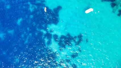 Overhead aerial view of beautiful mediterranean beach in summer season.