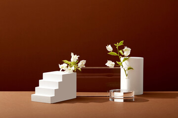 A front view of white and transparent podium decorated with flower and brown background with blank space for advertising 