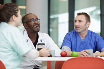 Fototapeta premium doctors and nurses in hospital rest room taking a break