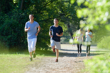 unidentified people running in park