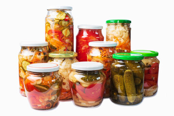 Fototapeta na wymiar Natural eco vegetables in various combinations canned in glass jars