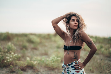 Beautiful girl posing outside on a windy warm day