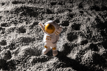 Spaceman stand on surface of alien planet.