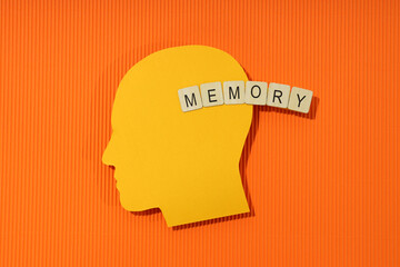 Concept of problems with memory, amnesia disease on orange background