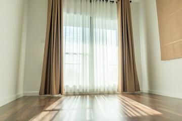Fototapeta na wymiar Curtain window interior decoration in living room on sunny day with sunlight