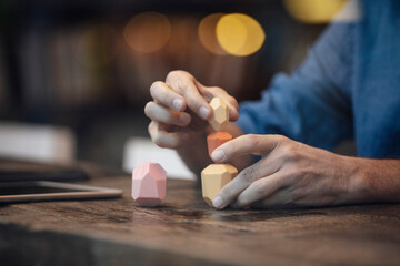 Businessman balancing stack of stones on table