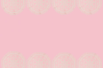 Spring creative frame with vintage embroidery lace placemat on pastel pink background. 80s, 90s...