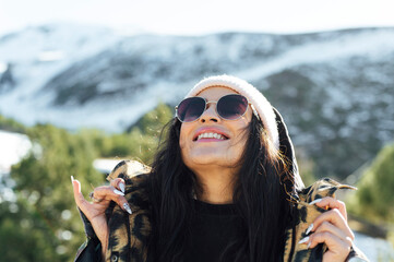 Smiling woman wearing sunglasses enjoying sunny day