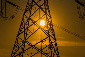 High voltage post,High voltage tower sky sunset background.