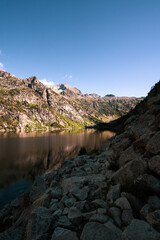 Fototapeta na wymiar High mountain lake during sunrise in summer