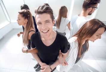 Fototapeta premium guy standing in a circle with his team