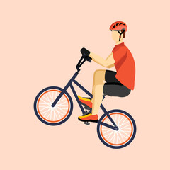 Young man jumping with bike over ramp