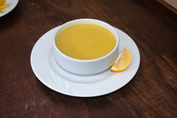 Traditional Turkish, Asian, red lentil soup served with a slice of lemon and pita bread