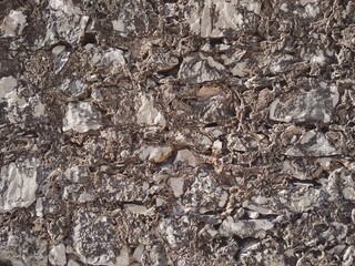 Fototapeta premium Stones of the old sea fortification as a background.