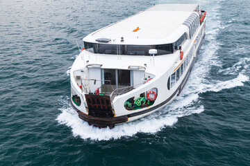 White passenger ferry goes on Golden Horn, Istanbul