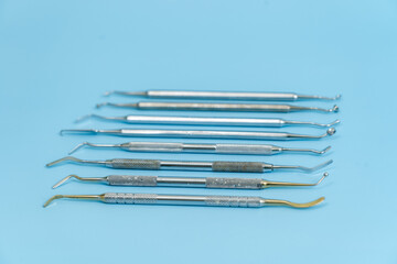 Dentist tool set. Teethcare, dental health concept. Blue background top view copy space