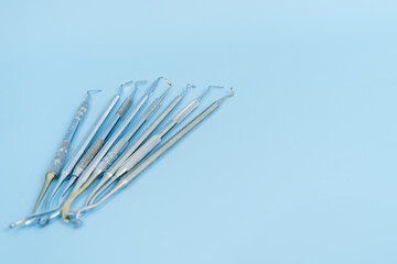 Dentist tool set. Teethcare, dental health concept. Blue background top view copy space