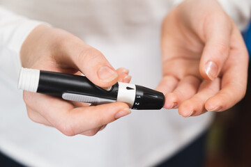 Diabetic child checks blood sugar