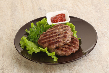 Grilled beef burger cutlet with sauce