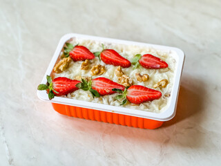 Turkish Traditional Ramadan Dessert Gullac with Strawberry. Take Away in Take Out Plastic Container Box.