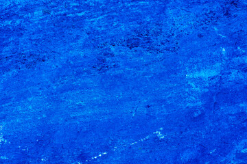 Abstract. Dark blue old concrete wall. The texture has an attractive unique pattern that is perfect for a Design background image.