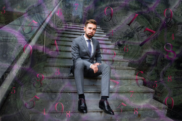 A man sits on a staircase surrounded by numbers and mystical signs, numerology
