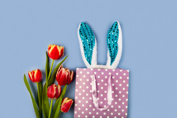 Gift bag with bunny ears and tulips.