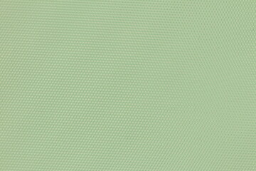 Texture of green plastic with a pattern. Decorative green plastic with a pattern. 