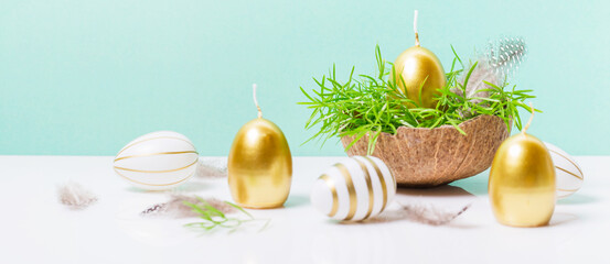 Happy Easter background, spring-time concept. Golden eggs, nests and bunny toys on blue