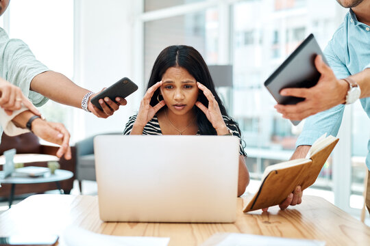 Wish You Had More Control Over Your Workday. Shot Of A Young Businesswoman Looking Stressed Out In A Demanding Office Environment.