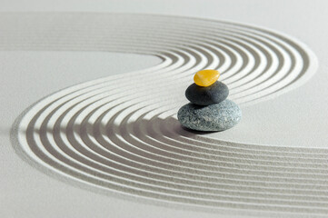 Japanese zen garden with yin and yang and feng shui in textured sand - obrazy, fototapety, plakaty