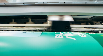 Graphic design and  advertising concept. Large format plotter, close up