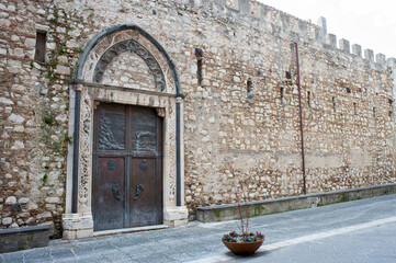 The city walls part of the Duomo with the West Gate. Taormina, Sicily