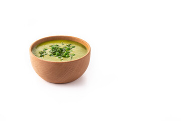 Green pea soup in a bowl isolated on white background. Copy space