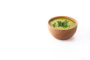 Green pea soup in a bowl isolated on white background. Copy space
