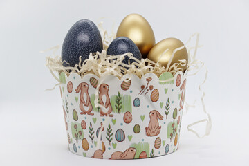 Painted Easter eggs are in paper packaging for Easter cakes
