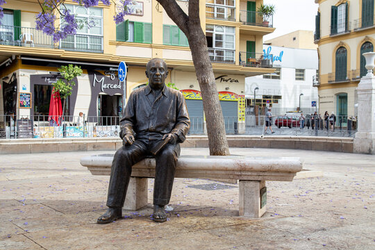 Malaga, Spain - May 24, 2019: Bronze statue of famous painter and sculptor Pablo Picasso. It was made by Francisco Lopez Hernandez and was inaugurated in 2008.