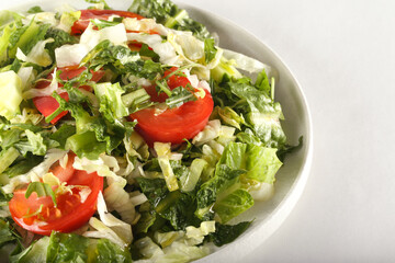 spring salad with herbs, cucumbers and tomatoes. Proper nutrition. Healthy lifestyle.