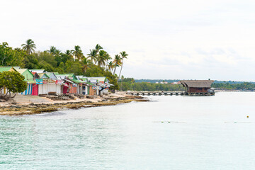 Picturesque landscape of the sea Caribbean coast with poor shacks
