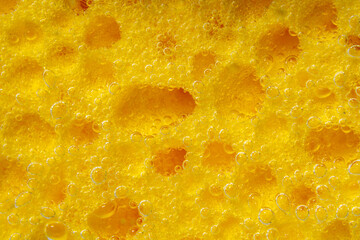 Background of moisture absorbing yellow sponges. Porous water or fabric. Sponge