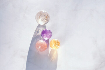 quartz crystals balls on abstract marble background. Magic Witchcraft Ritual, healing crystal...