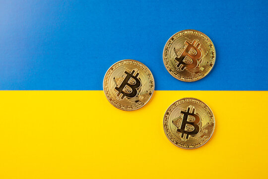 Bitcoin with Ukraine flag blue and yellow background. 