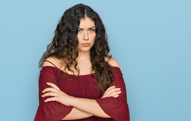 Young hispanic girl wearing casual clothes skeptic and nervous, disapproving expression on face...