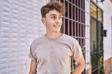 Fototapeta premium Young caucasian man smiling happy standing at the city.
