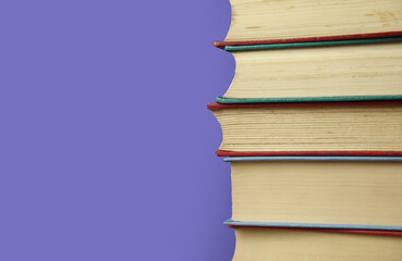 Book collection on purple background