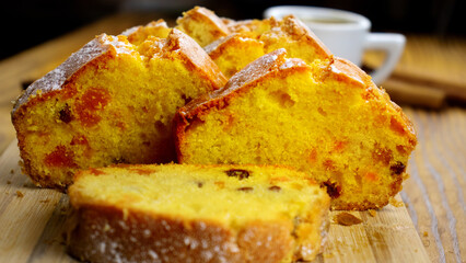 image of a delicious cupcake with raisins and candied fruit on a board close-up