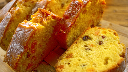 image of a delicious cupcake with raisins and candied fruit on a board close-up