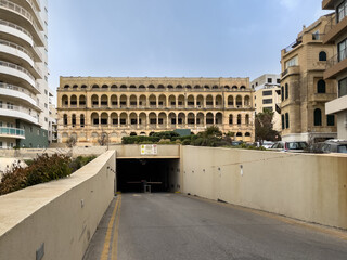 Naklejka premium Road leading to the entrance of an underground car park under the Fort Cambridge officers’ mess, built in 1905 for the British army in Sliema, Malta.