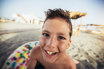Happy boy having funl on the beach